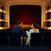 Couple seated in velvet theater seats before the curtain rises, Theater & Broadway Shows experience gift