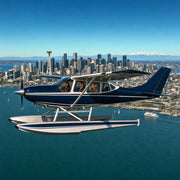 Pilot and passengers in a floatplane banking over the city, Seattle Thrilling Experience Collection experience gift