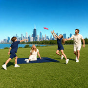 Family playing frisbee on a lakefront lawn by the skyline, Chicago Together experience gift