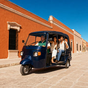 Driver taking a couple down a sunlit old-town street in a tuk-tuk, Tuk Tuk & Rickshaw Tours experience gift