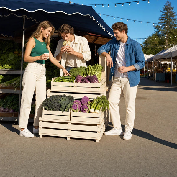 Three friends sampling fresh produce at a farmers market stall, Vegan & Vegetarian Food Tour experience gift