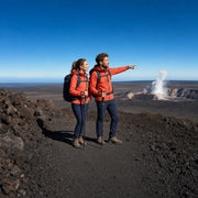 Couple on a crater rim trail watching steam rise from a distant vent, Volcano Hikes experience gift
